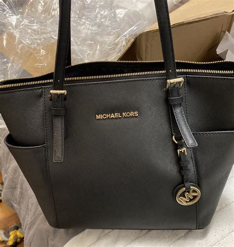 michael kors tasche reißverschluss kaputt|Michael Kors luggage repair.